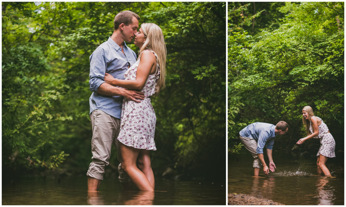 couple together in creek kissing and throwing water